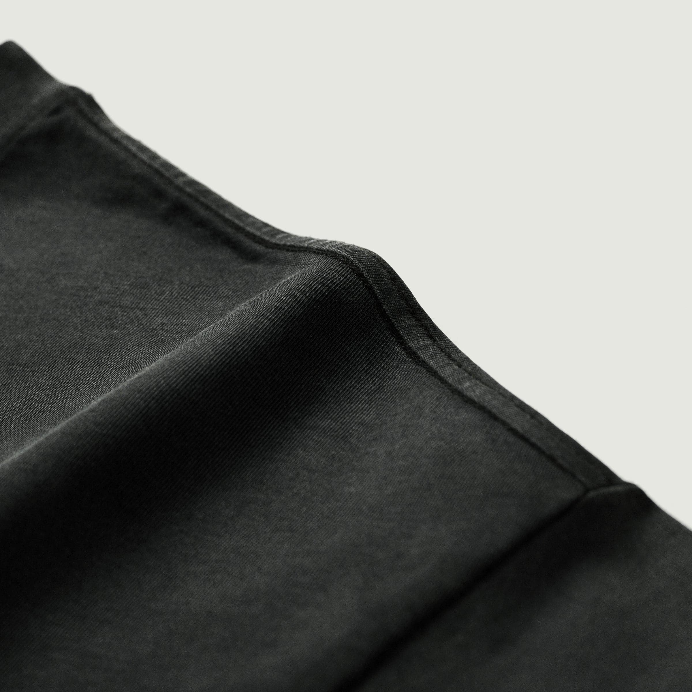 Aeterna Filigree media image showing dark washed shoulder seam close-up detail