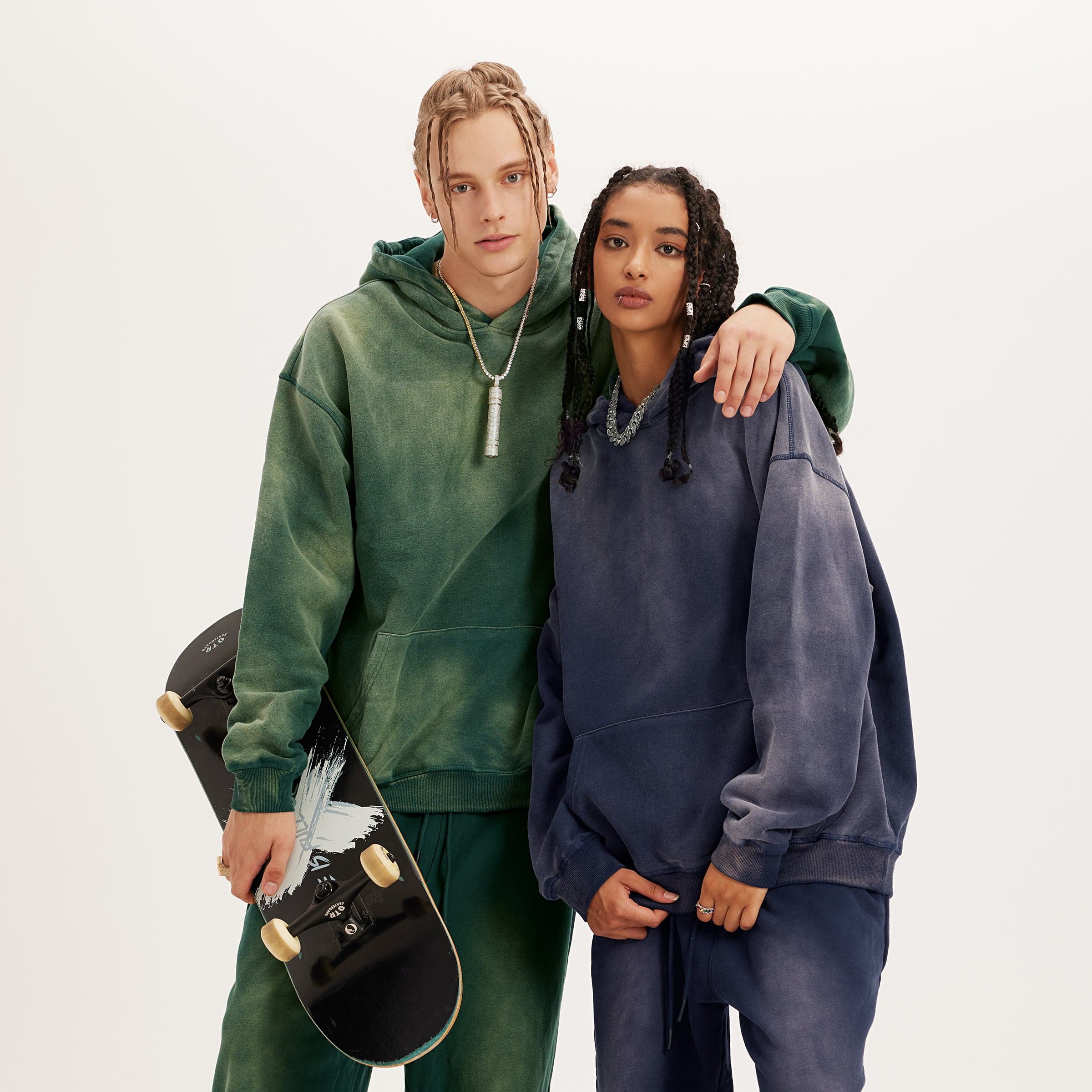 Aether Rune oversized graphic hoodie lifestyle image with two models in green and navy washed hoodies