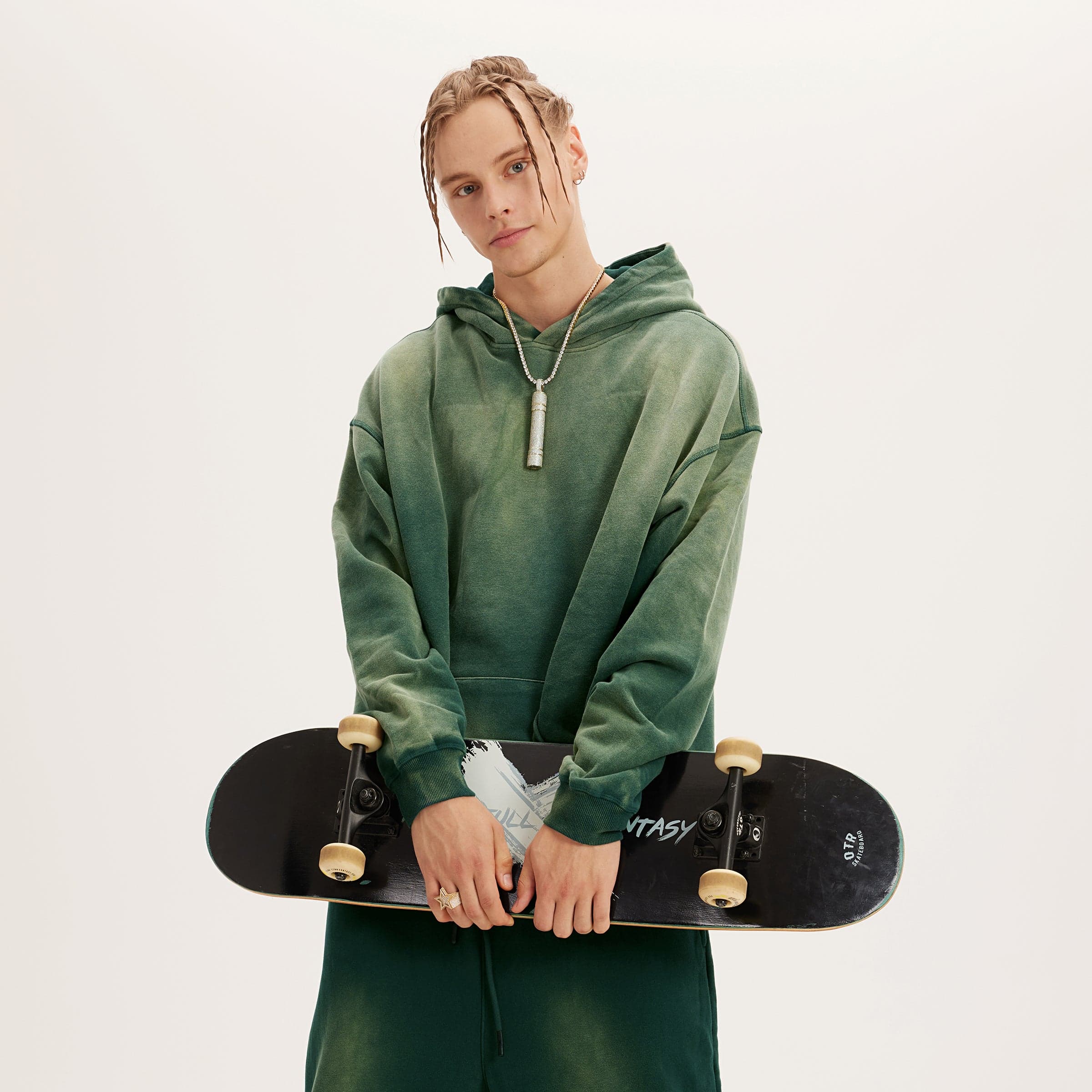 Aether Rune oversized graphic hoodie male model front fit view holding skateboard