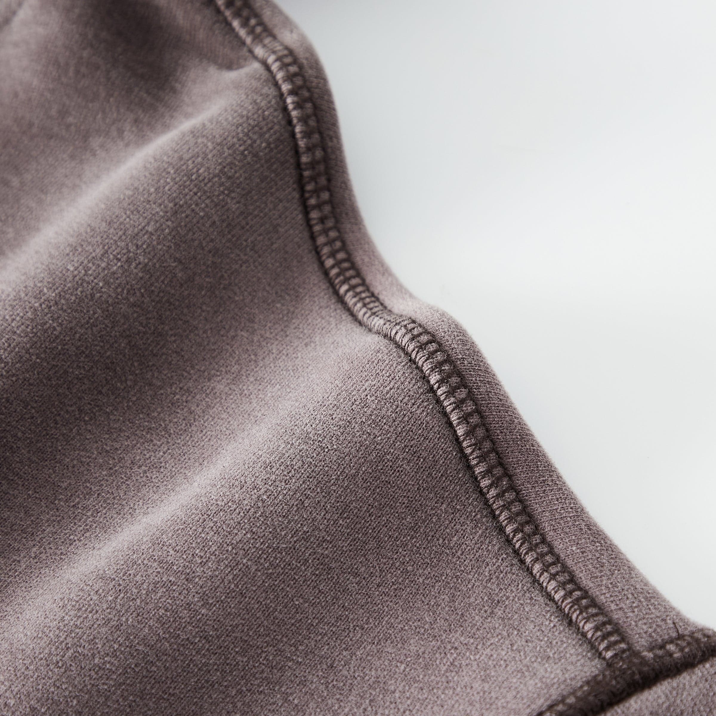Aether Rune media image showing washed hoodie side seam close-up detail