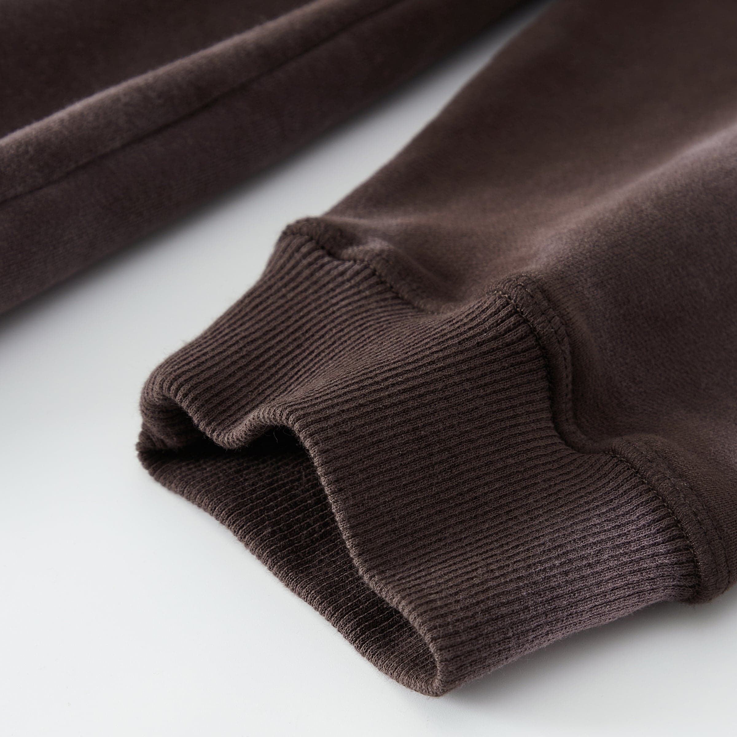 Aether Rune washed brown hoodie ribbed cuff close-up detail