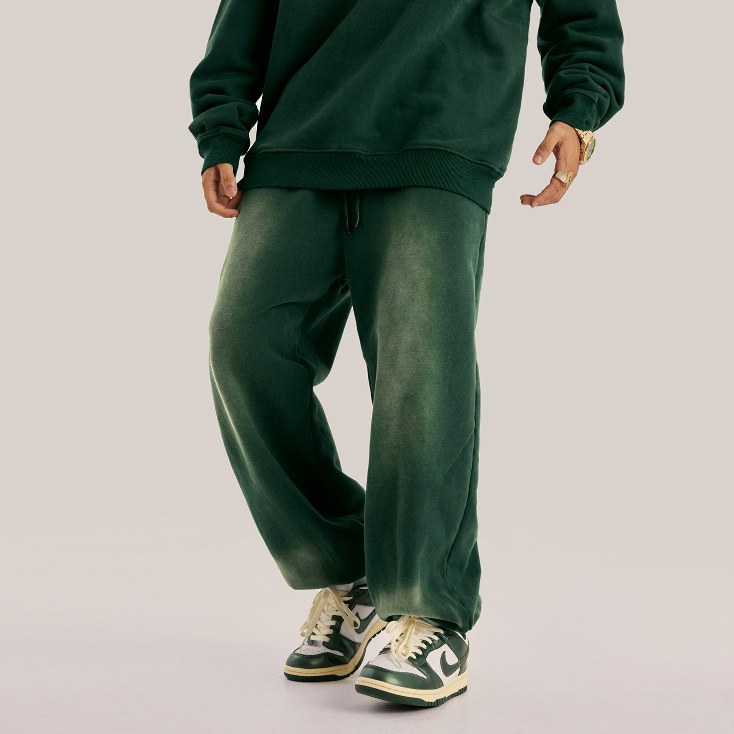 Akant Noir embroidered sweatpants front lower fit view on model in green sample color