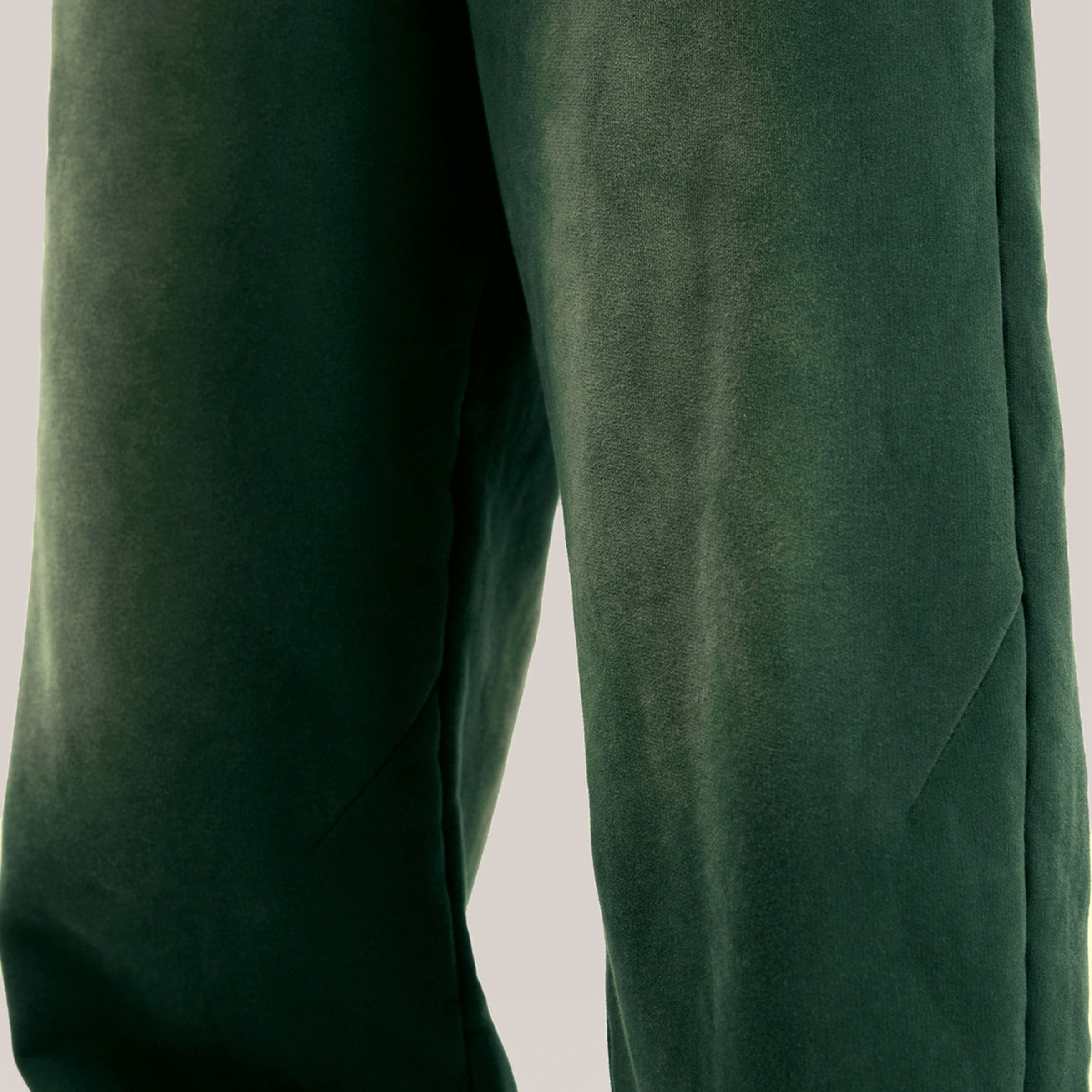 Akant Noir media image showing green sample sweatpants leg fabric close-up detail