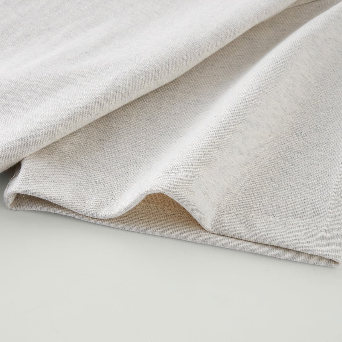 Astra oversized graphic tee: close-up view of the sleeve hem