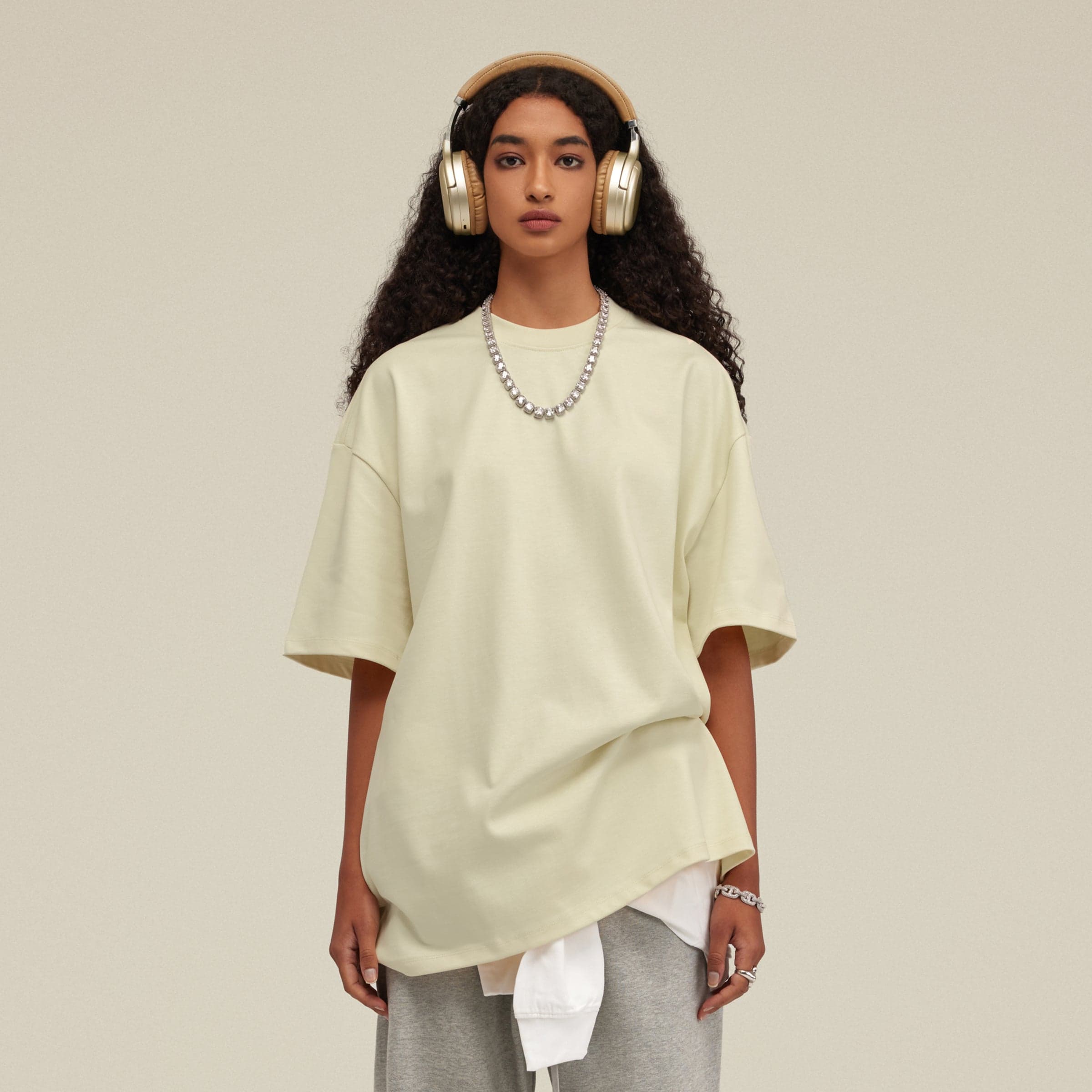 Front view of a women's model wearing an Astra oversized graphic tee.