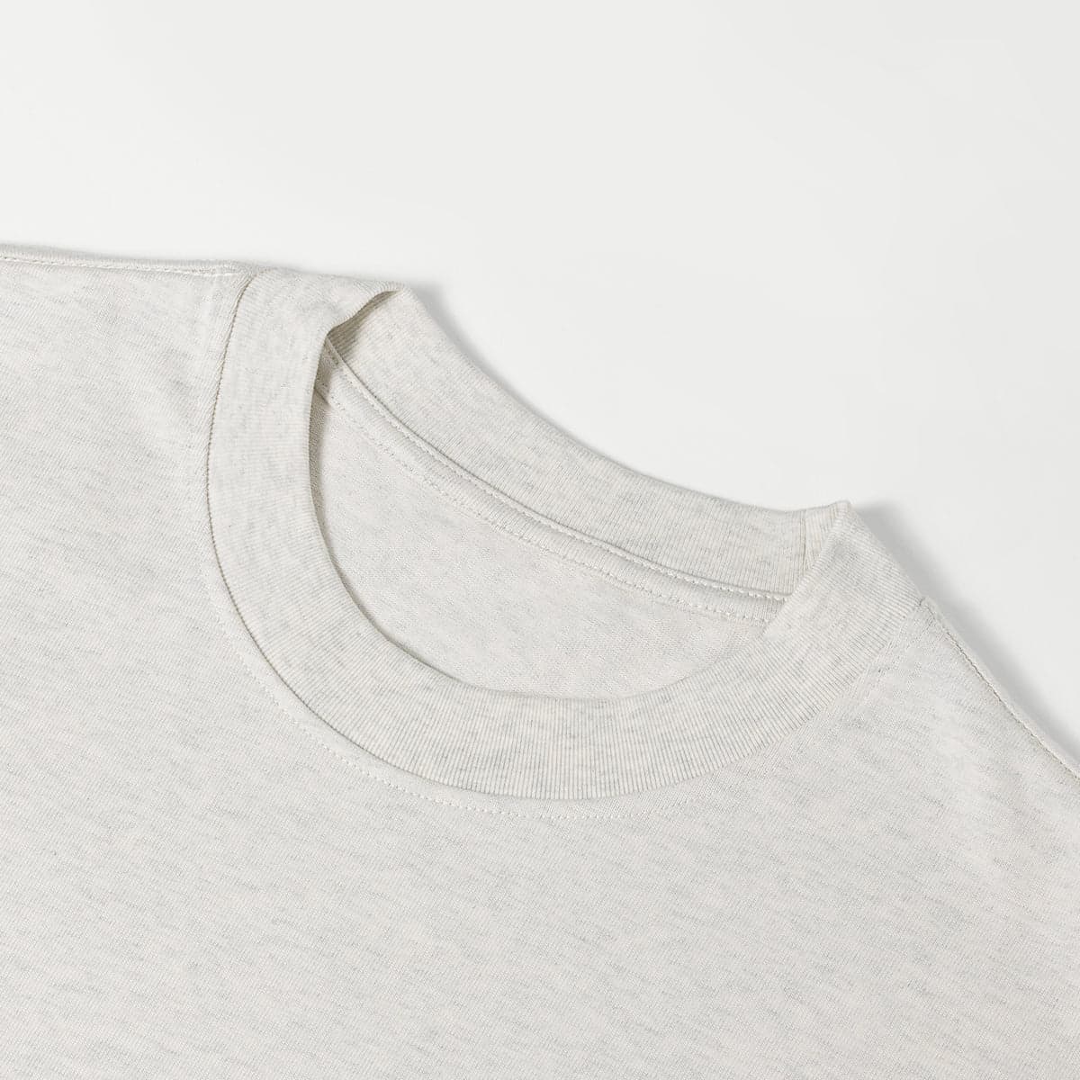 AURA oversized graphic tee collar close-up detail