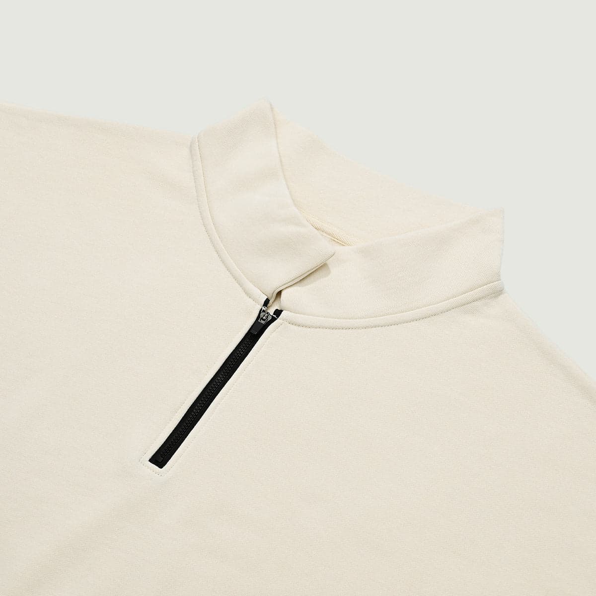 AURACORE graphic half-zip sweatshirt stand collar and zipper close-up detail