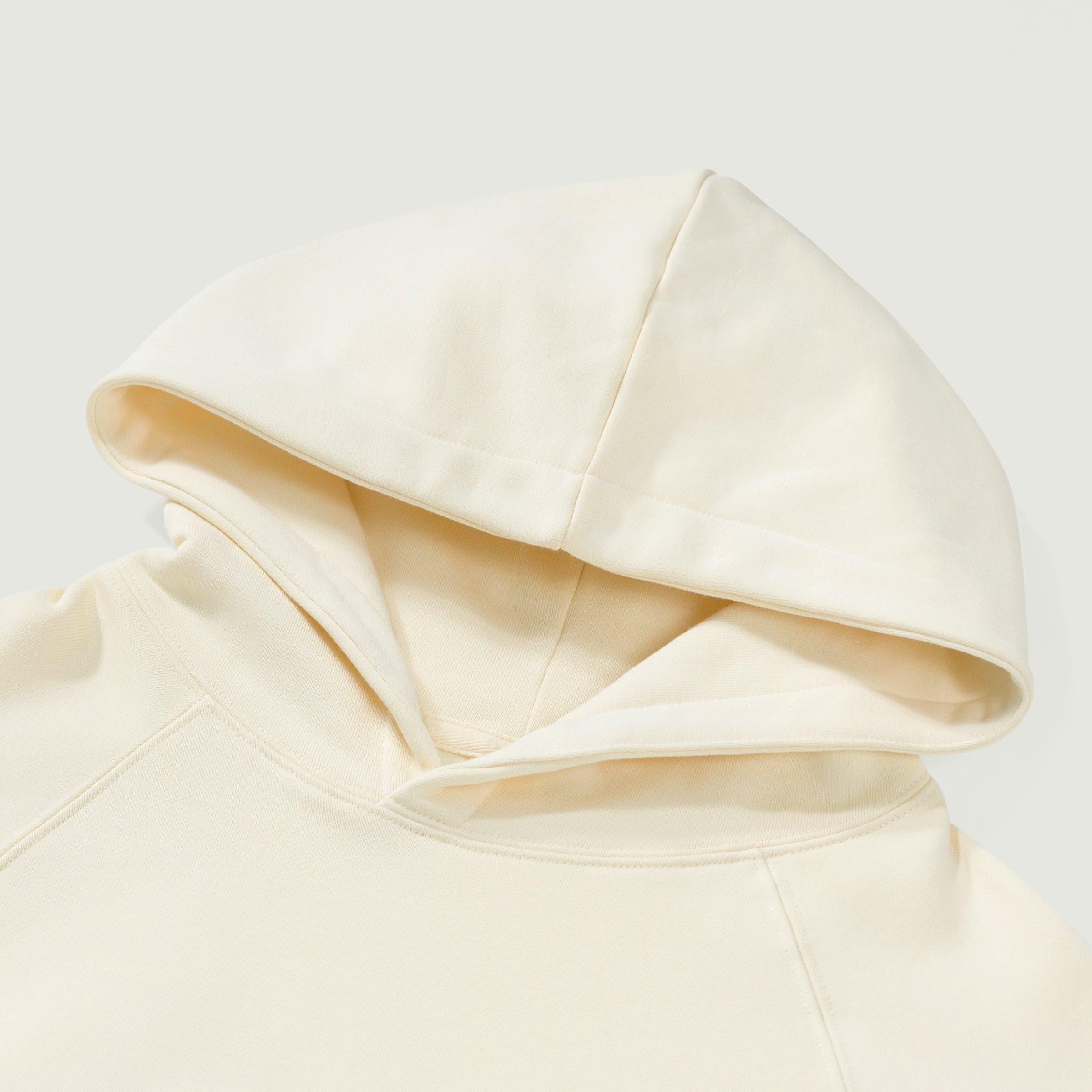 Crownfall oversized graphic hoodie hood close-up detail in white cotton