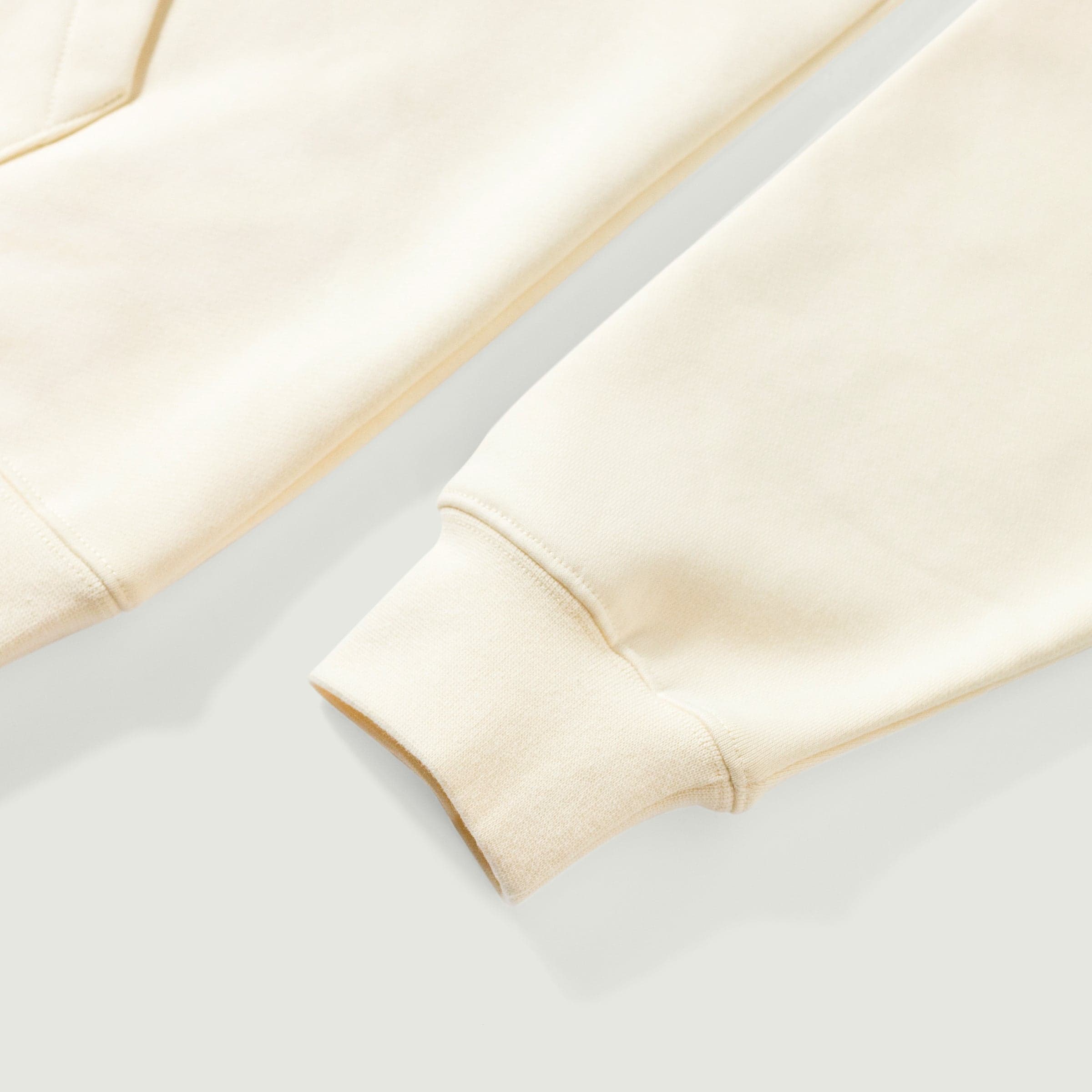 Crownfall oversized graphic hoodie sleeve and cuff close-up detail