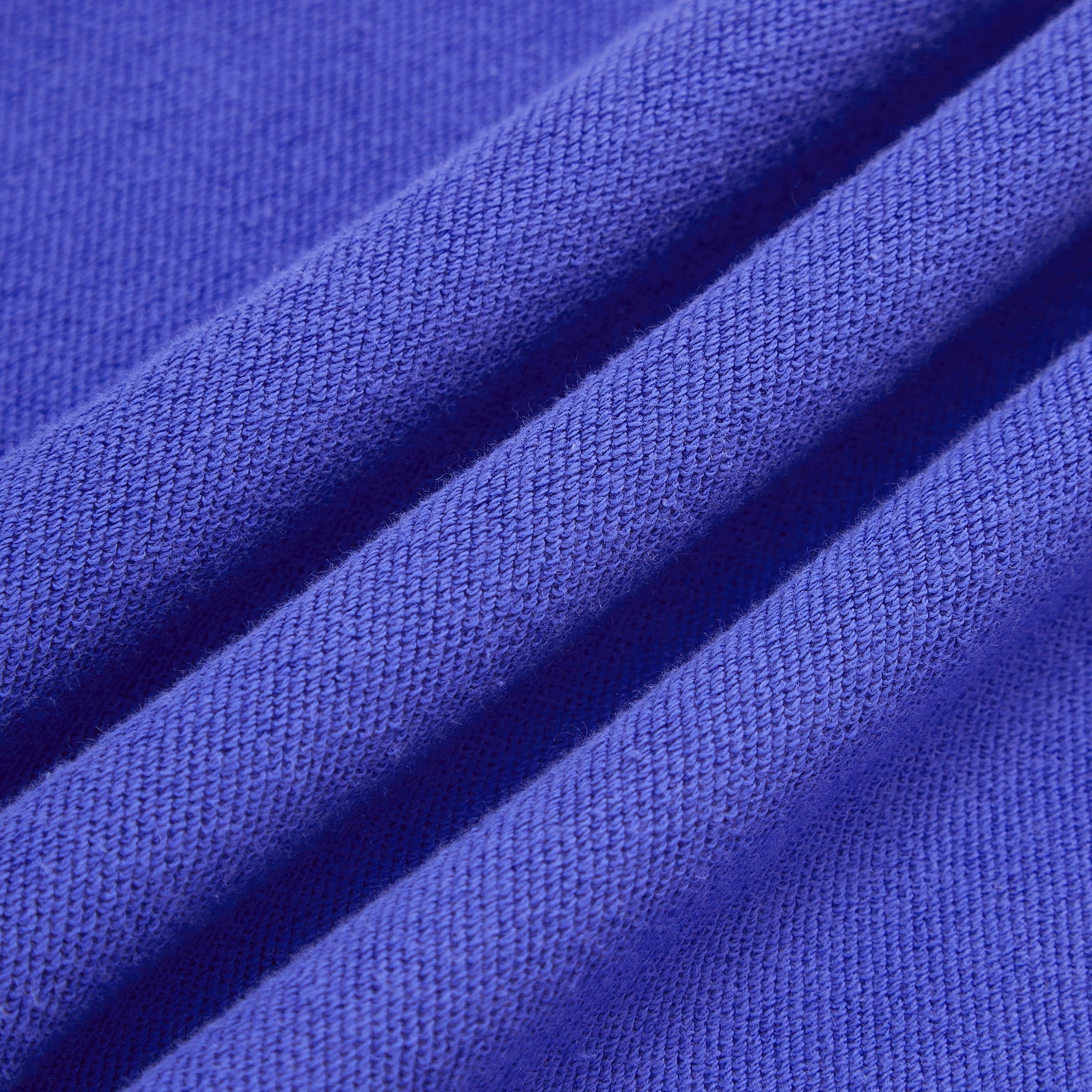 DRGN FLUX media image showing blue sample sweatpants fabric drape close-up detail