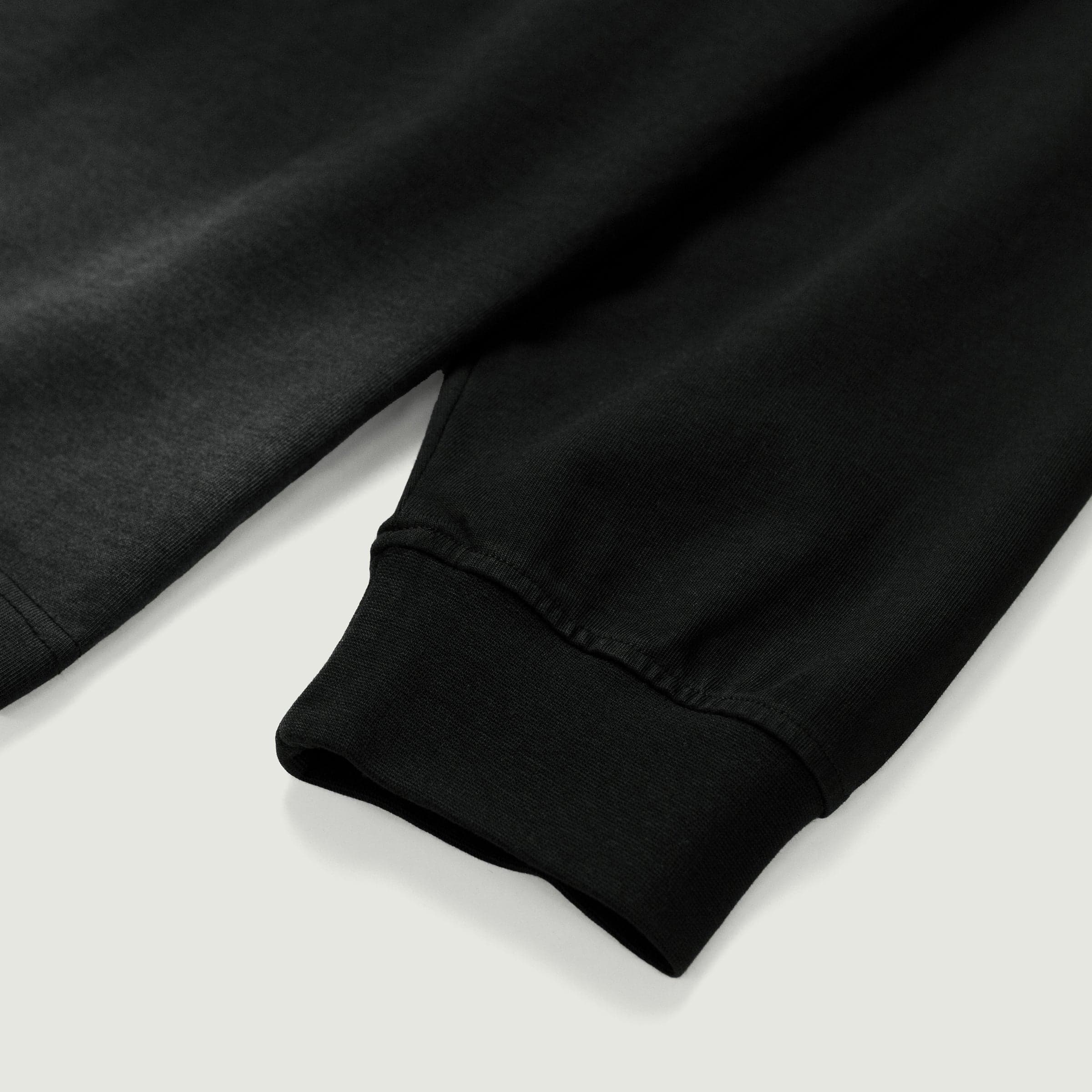 FALLEN GRACE media image showing washed dark grey cuff close-up detail