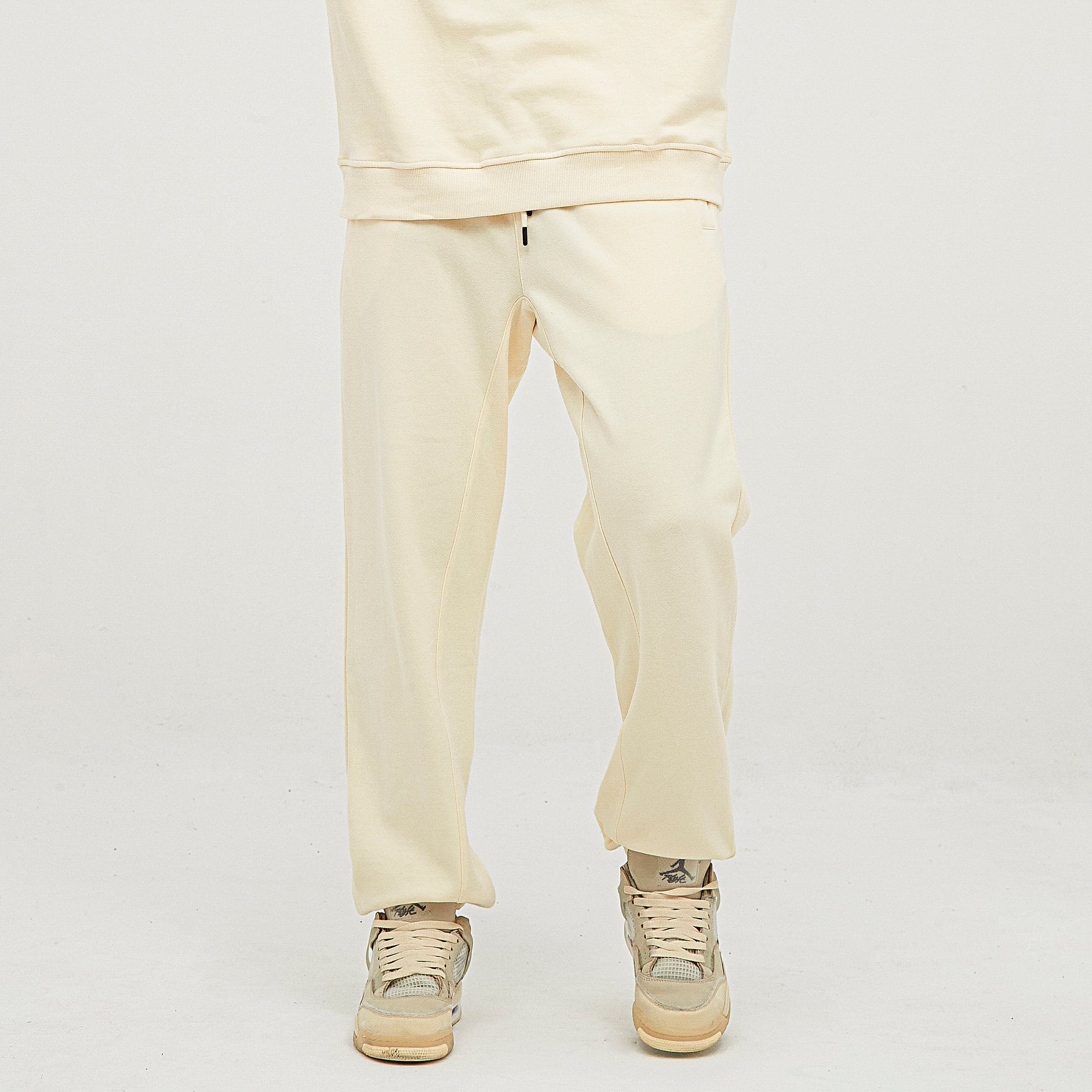 Flora embroidered sweatpants angled front lower fit view on model