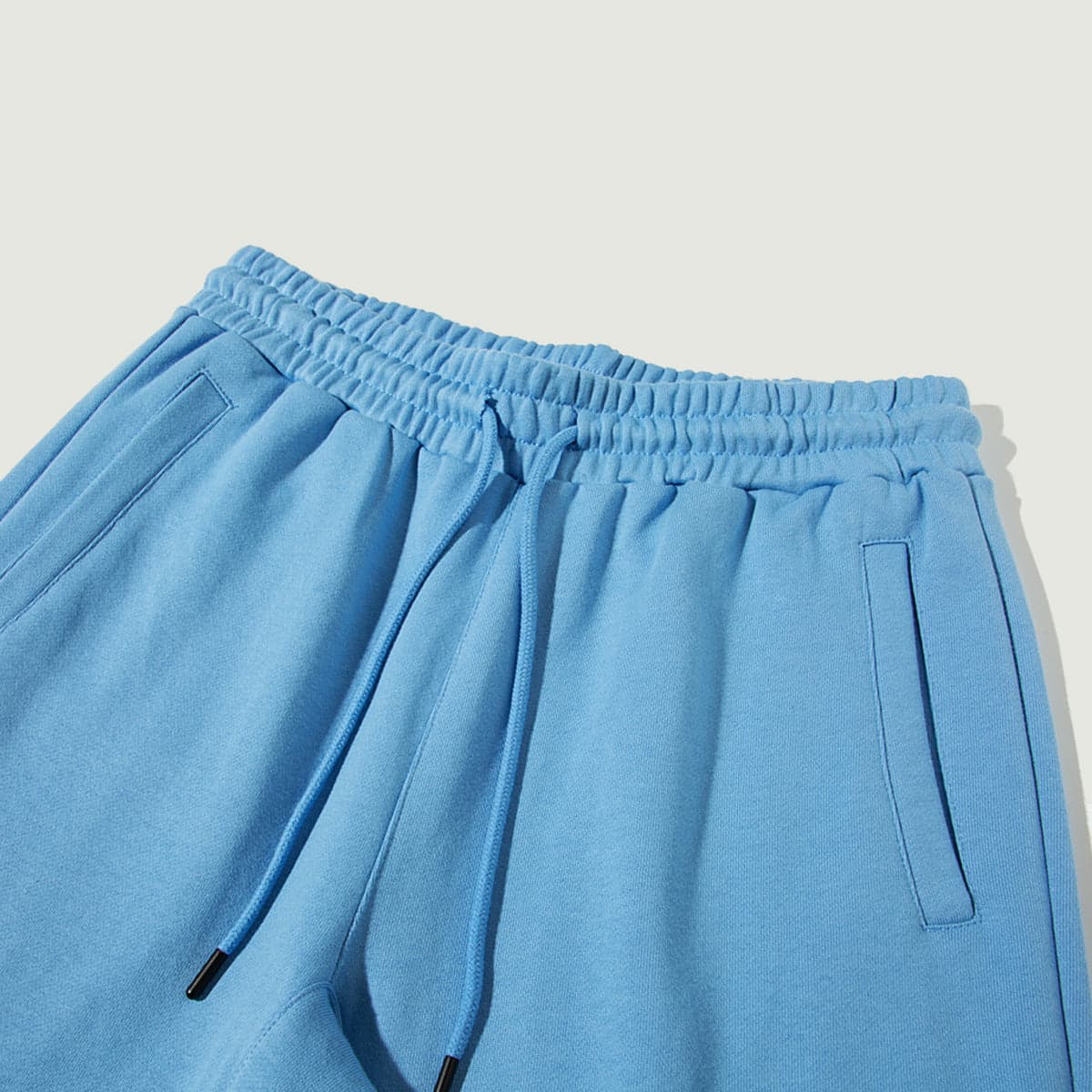 Flora media image showing blue sample sweatpants waistband close-up detail