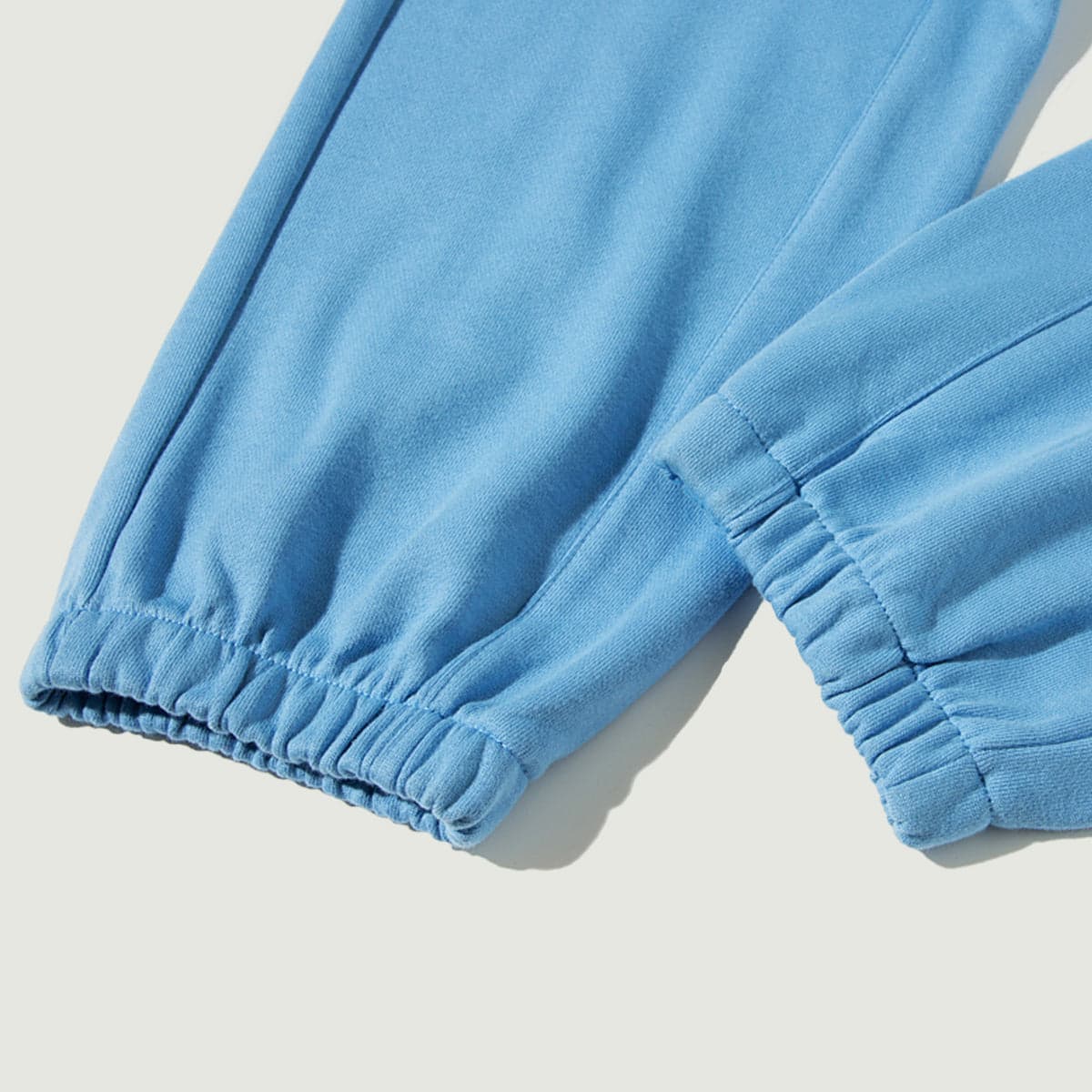 Flora media image showing blue sample sweatpants cuff close-up detail