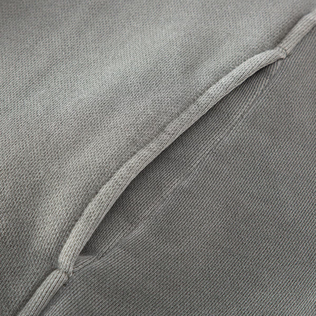 HELLCHAIN oversized graphic hoodie shoulder seam close-up on washed grey fabric