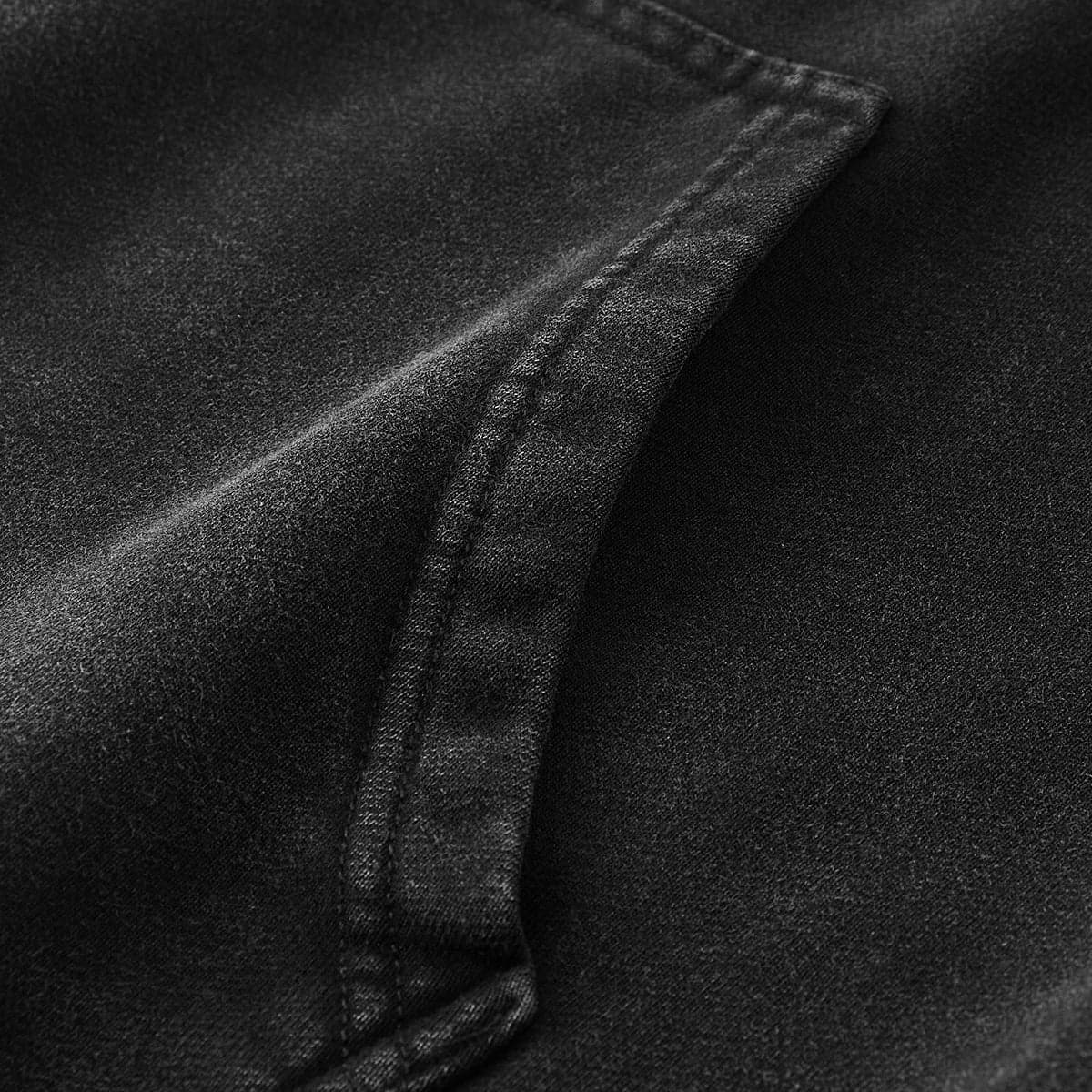 washed hoodie seam detail close up in black cotton