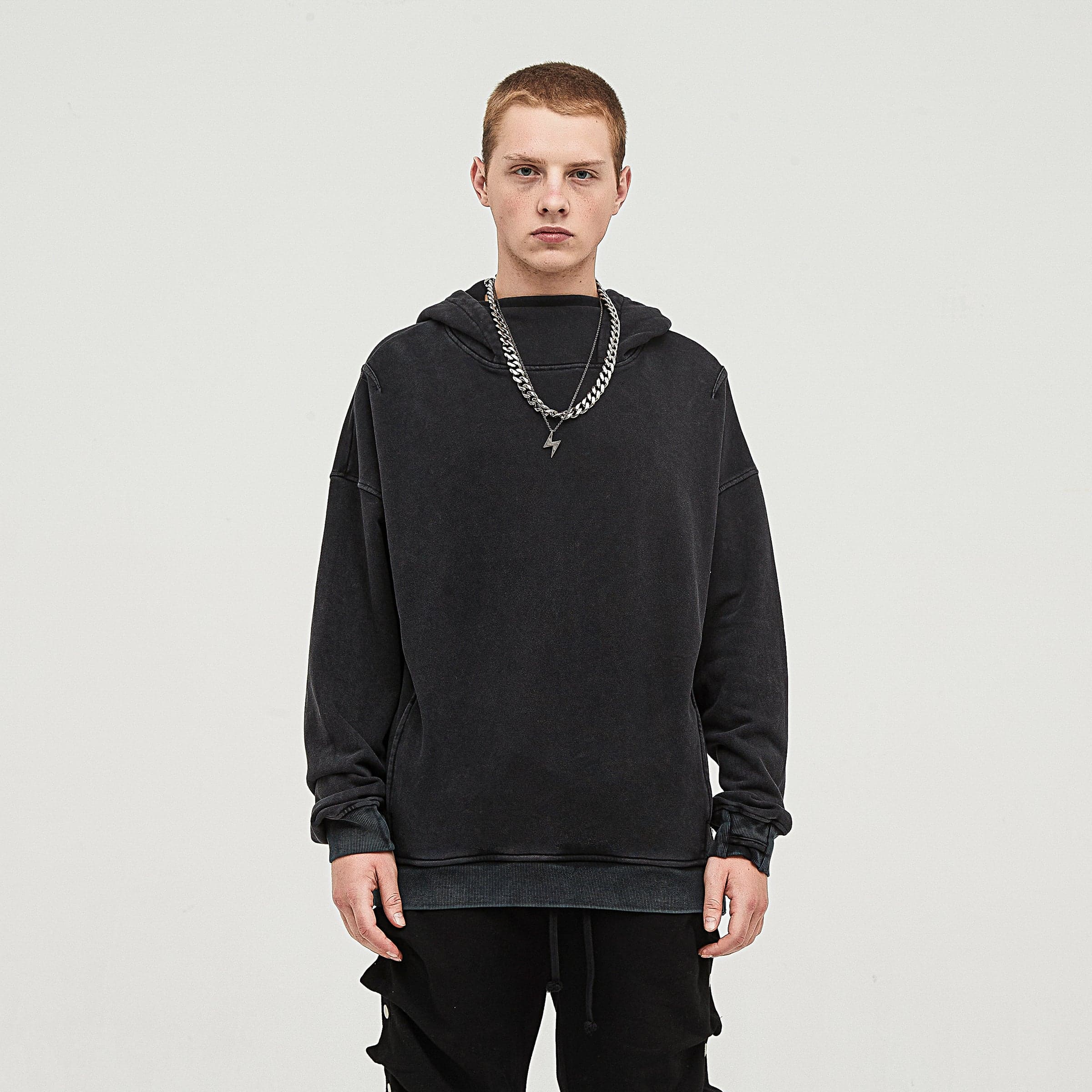 NOX media image showing male model wearing a black sample hoodie front view