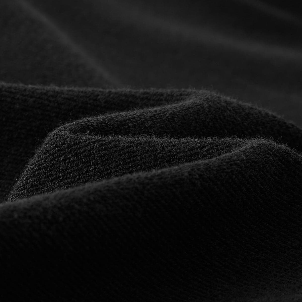 Purple Haze media image showing black hoodie fabric texture close-up