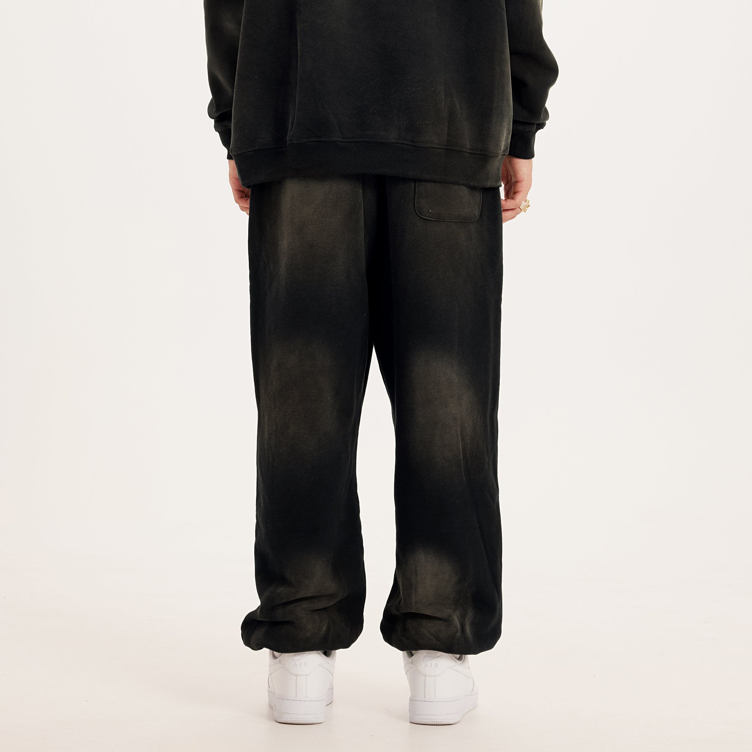 REIGN embroidered sweatpants back lower fit view on model