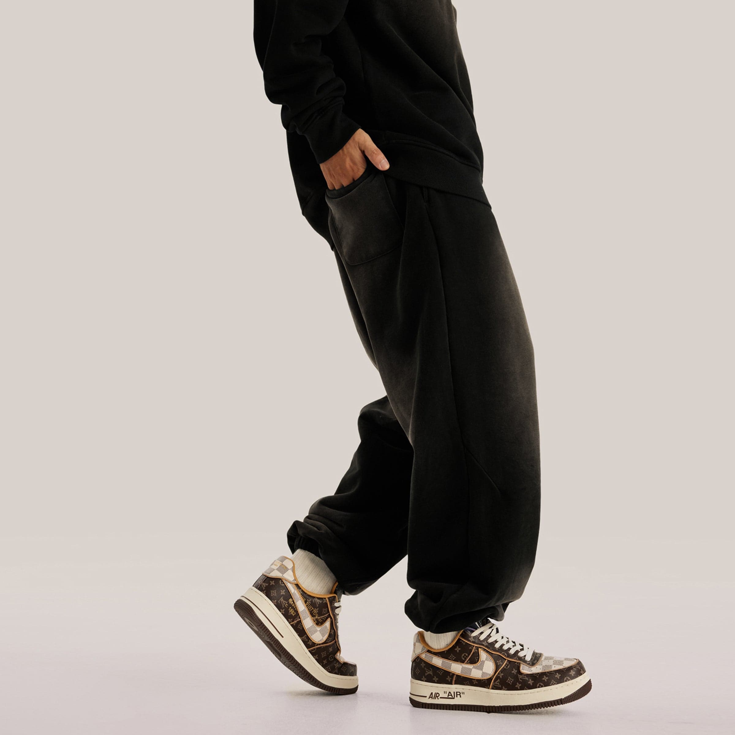 REIGN embroidered sweatpants angled front fit view on model