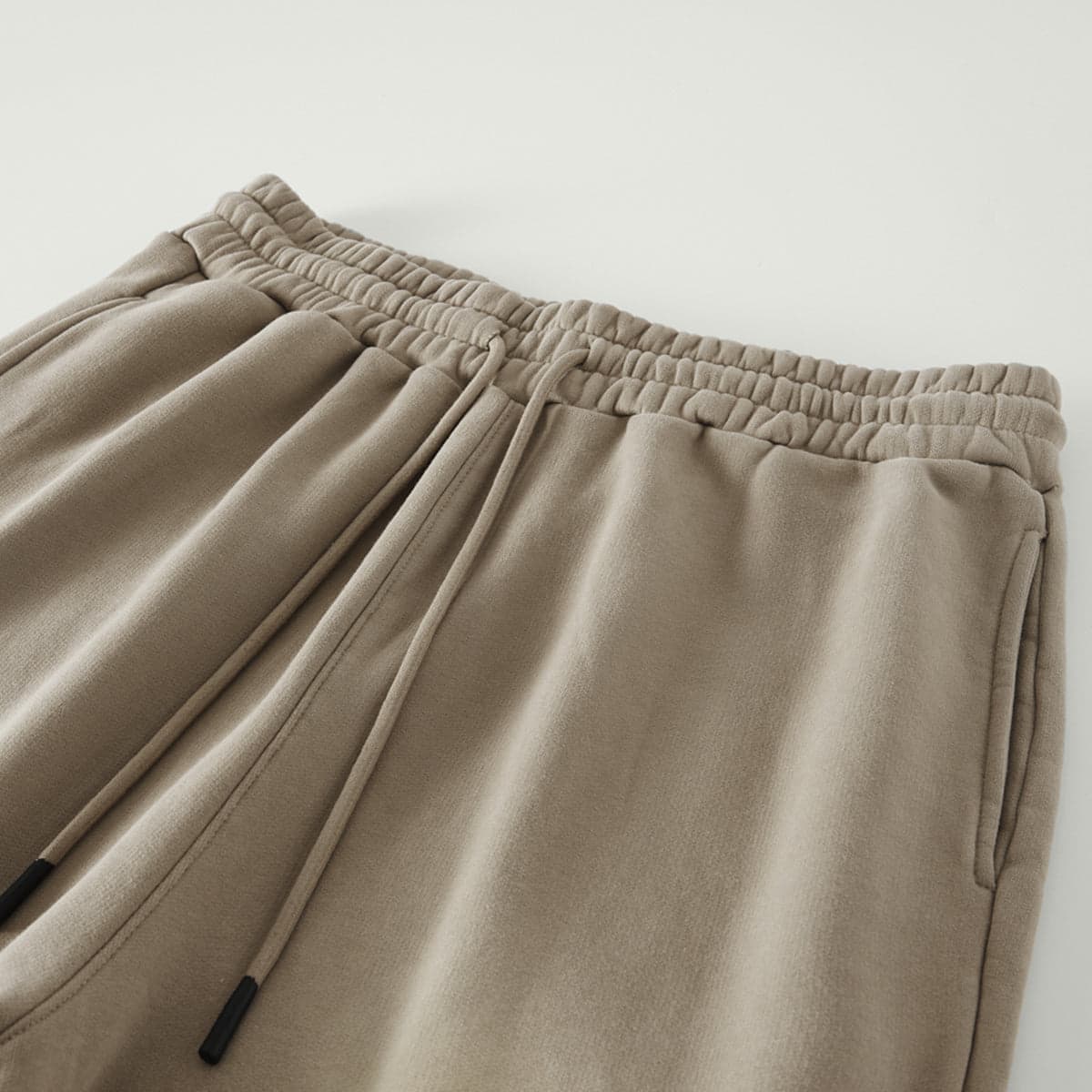 REIGN media image showing beige sample sweatpants waistband close-up detail