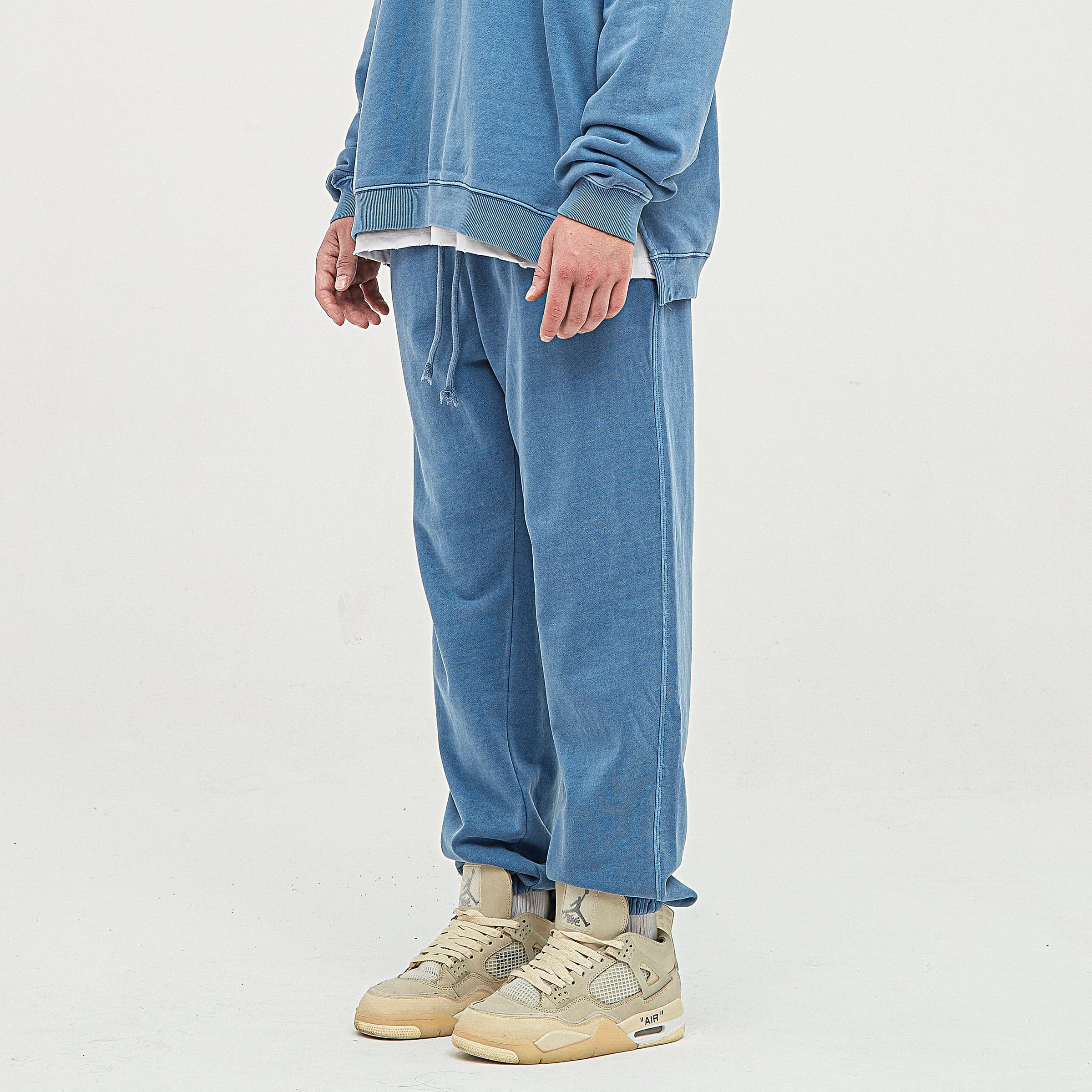 Relic embroidered sweatpants angled side fit view on model