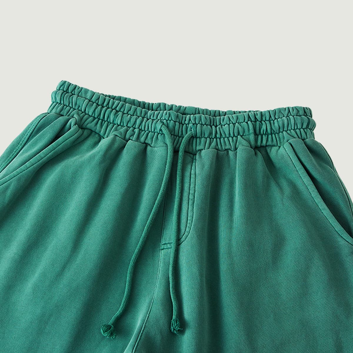 Relic media image showing green sample sweatpants waistband close-up detail