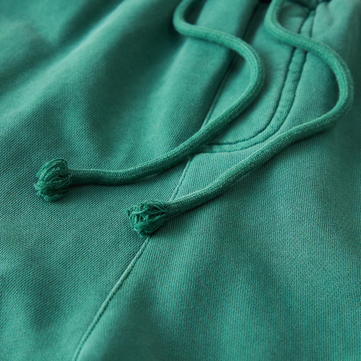 Relic media image showing green sample sweatpants drawstring close-up detail