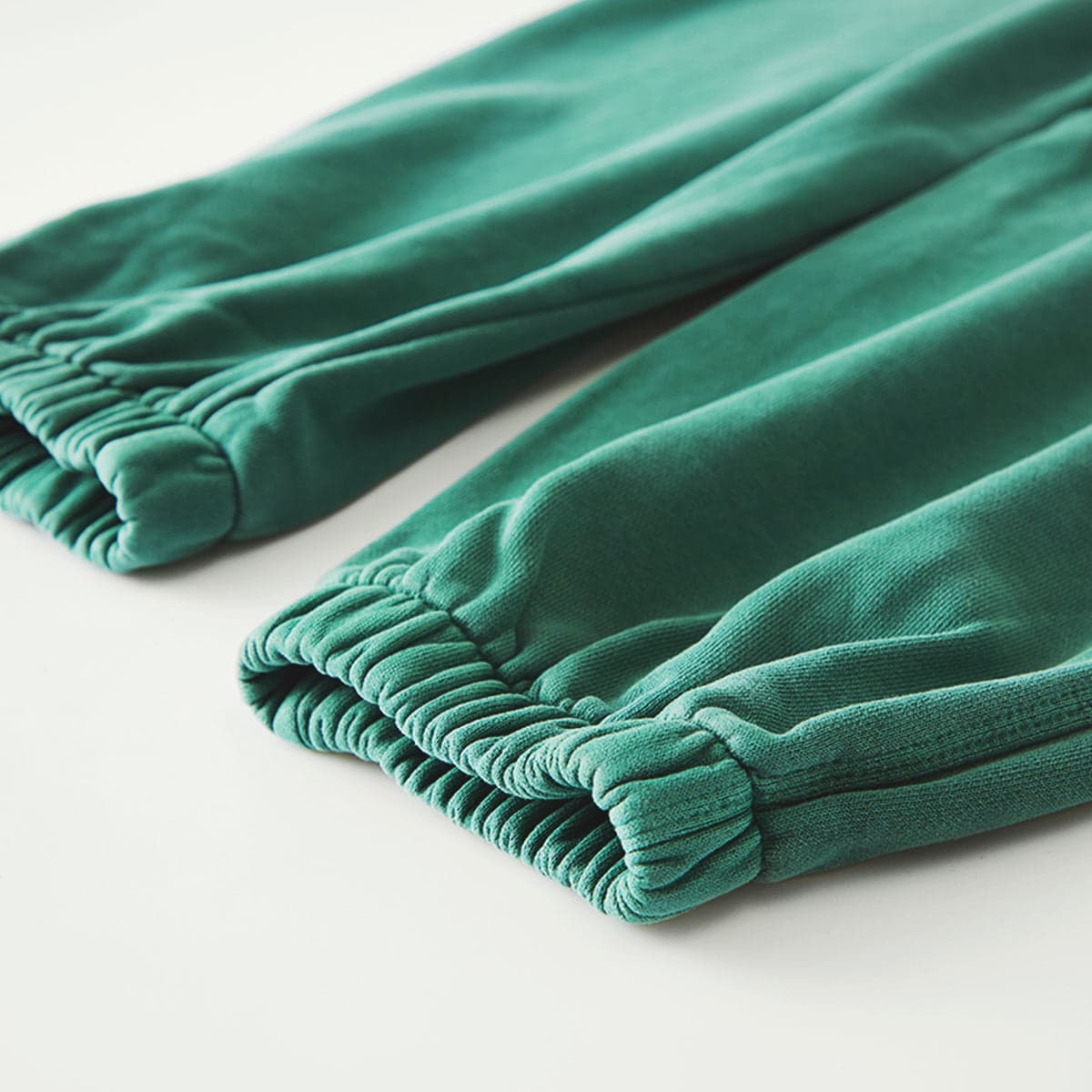 Relic media image showing green sample sweatpants cuff close-up detail