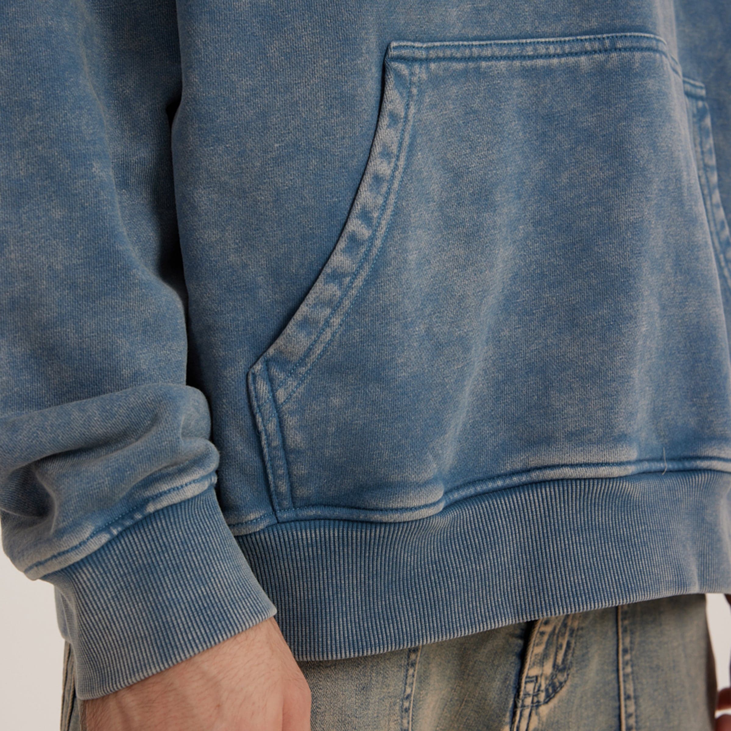 Retro Beat media image showing blue hoodie kangaroo pocket close-up detail