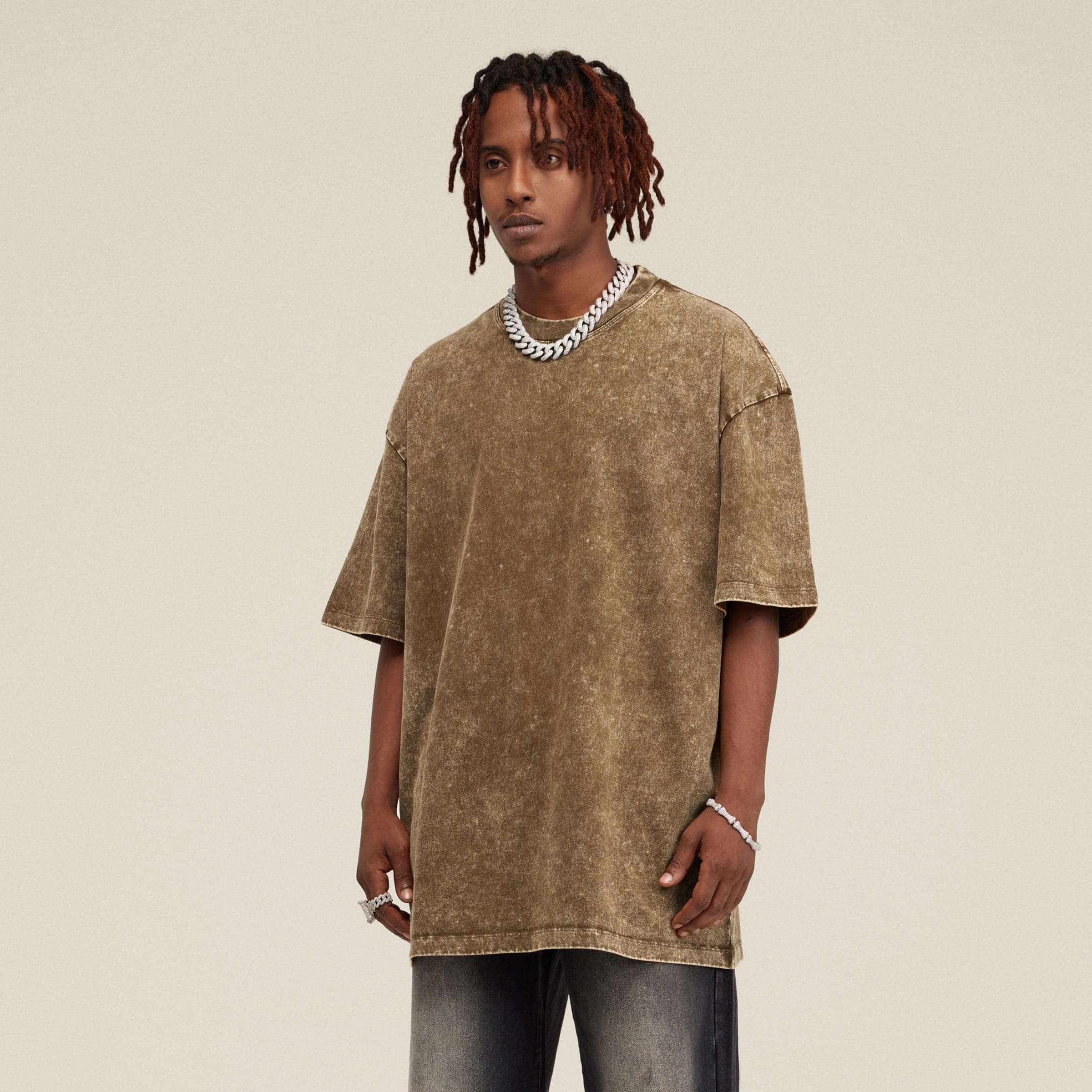 Seraph Coil media image showing male model wearing a brown washed oversized tee angled front view