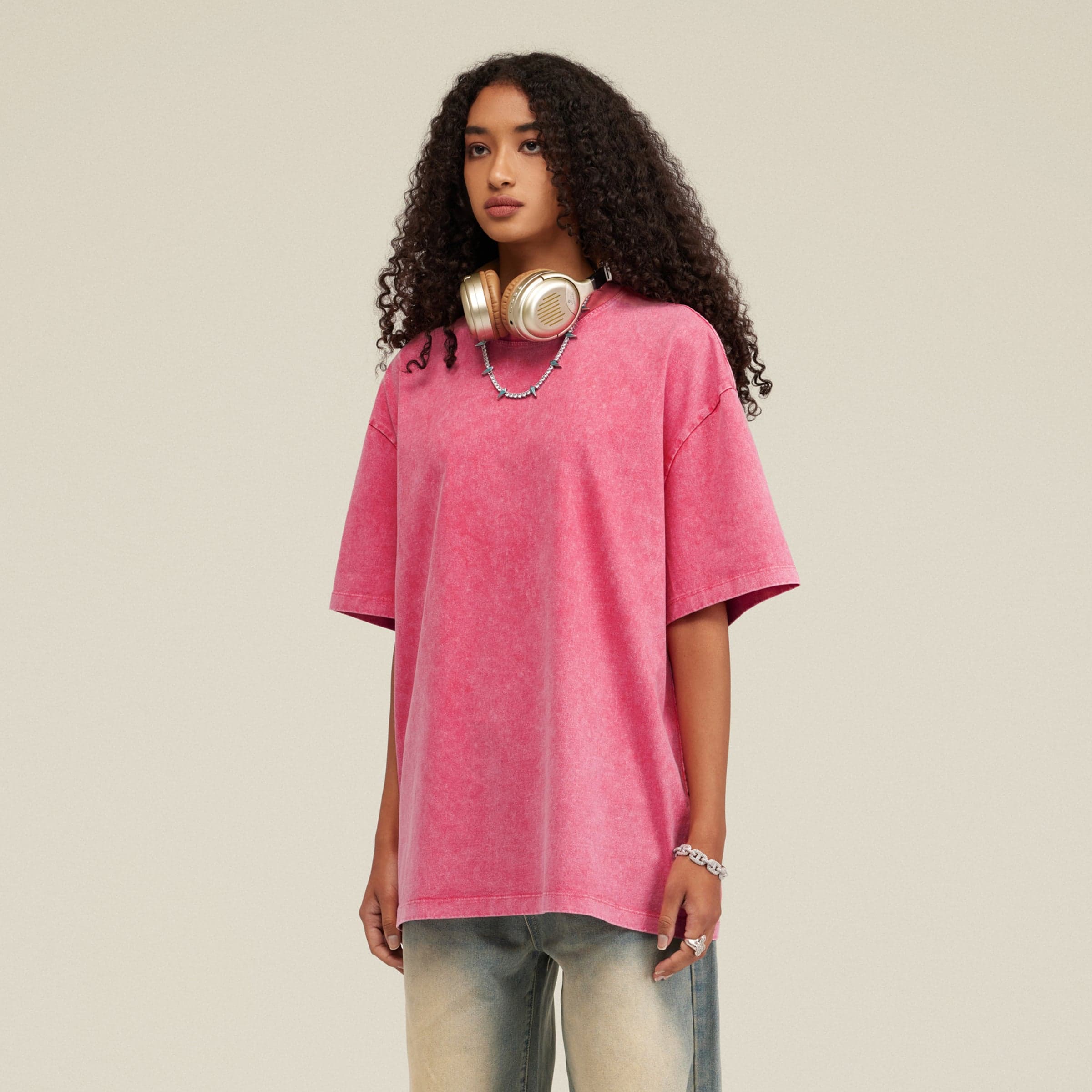 Seraph Coil media image showing female model wearing a pink oversized tee angled front view