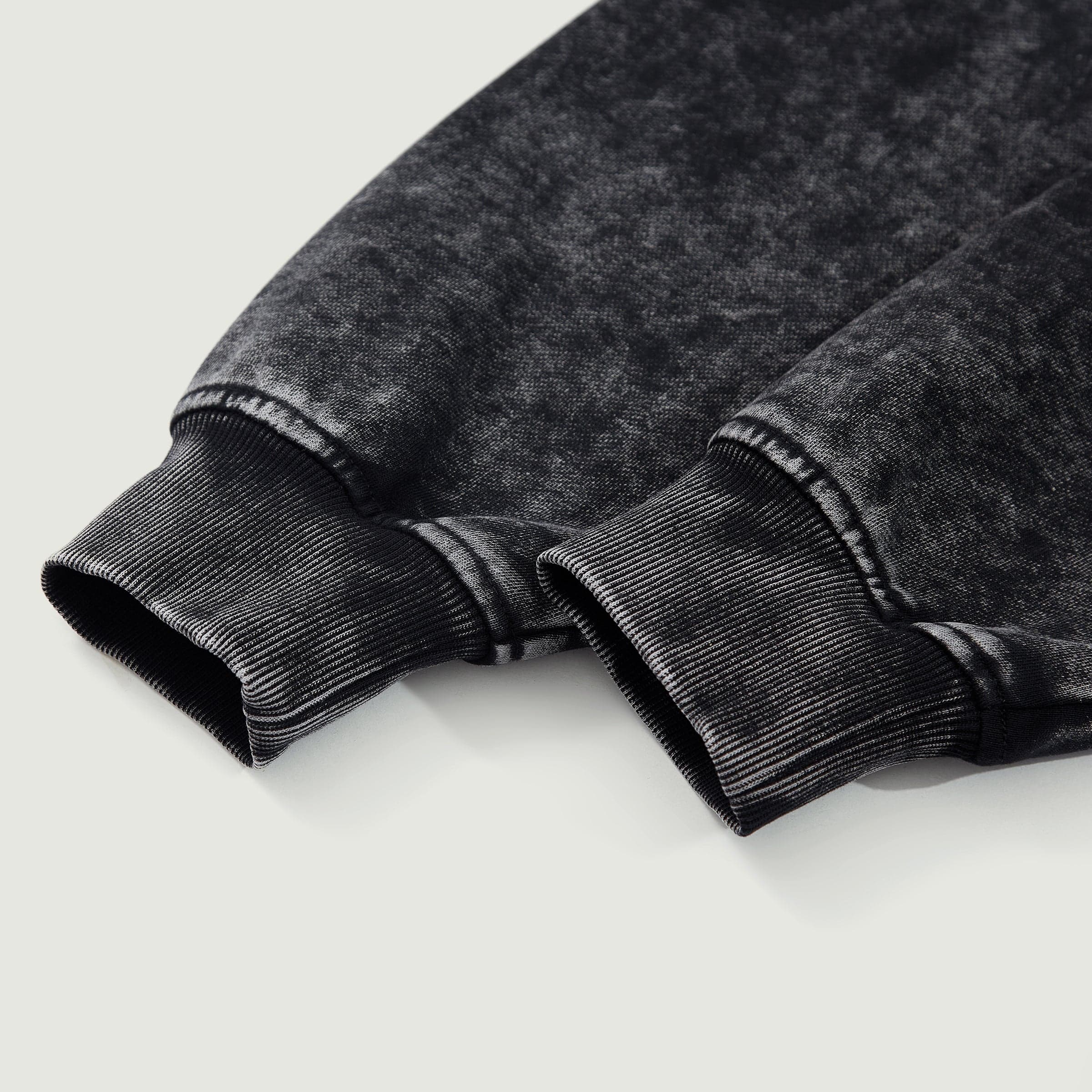 Winged Spear graphic zip up hoodie cuff close-up detail in washed black cotton