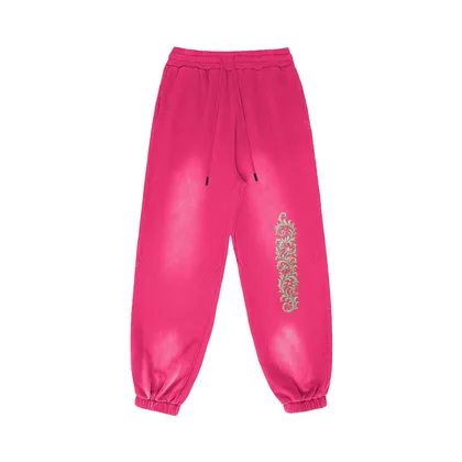Akant Noir embroidered sweatpants front view in washed pink with full leg embroidery